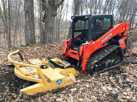 landscape skid steer in a shop|lawn mowing skid steer.